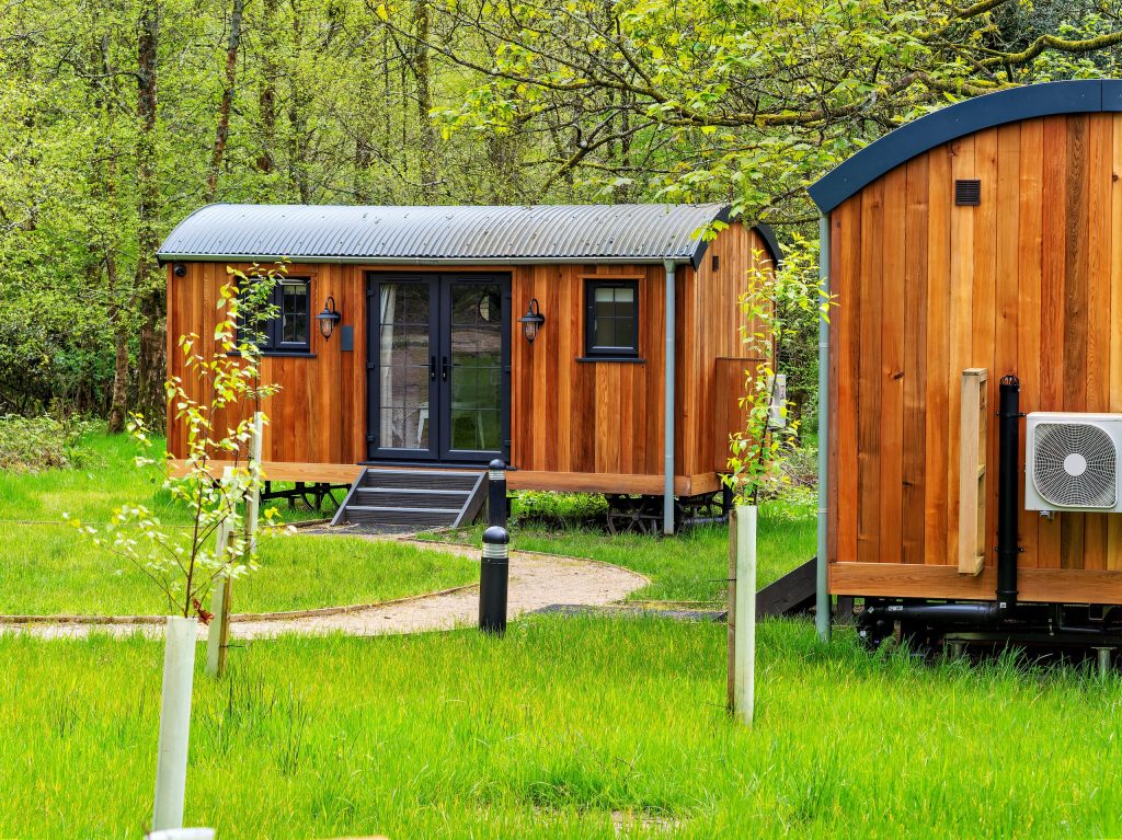 Tiny wooden homes and cabins in a rural setting